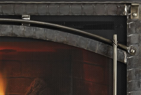 Close up showing a safety screen in-front of a fireplace