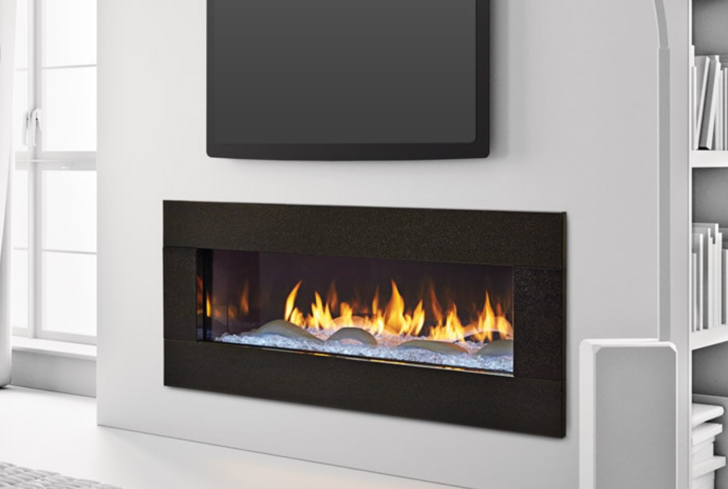 Fireplace in a white home placed below a TV