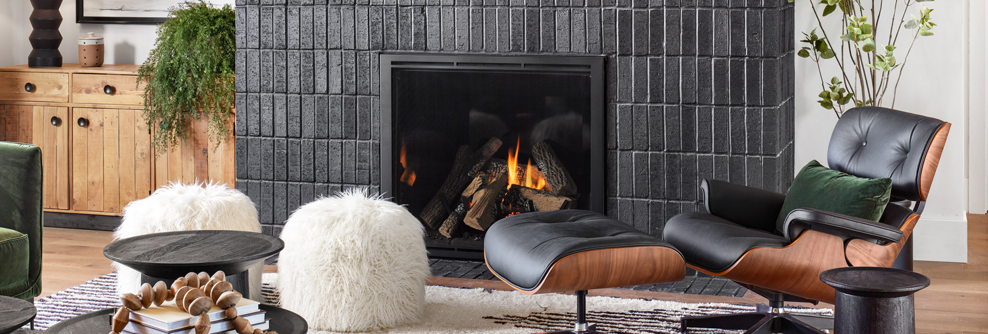 Black tile fireplace in a home with modern furnishings
