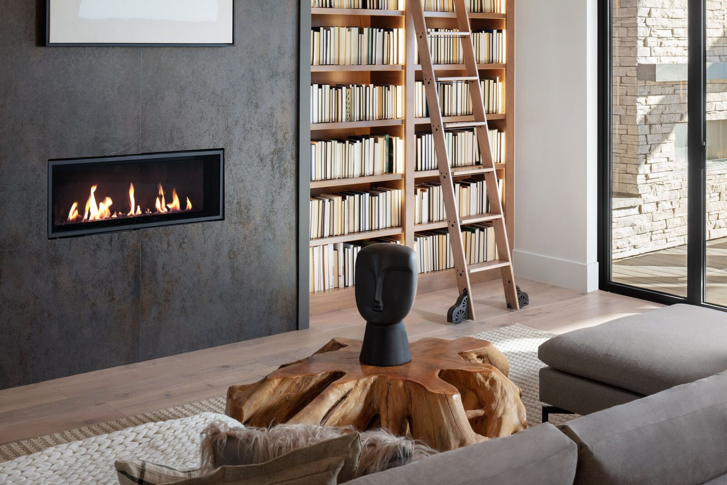Living room of a home with a wide and short fireplace in its wall