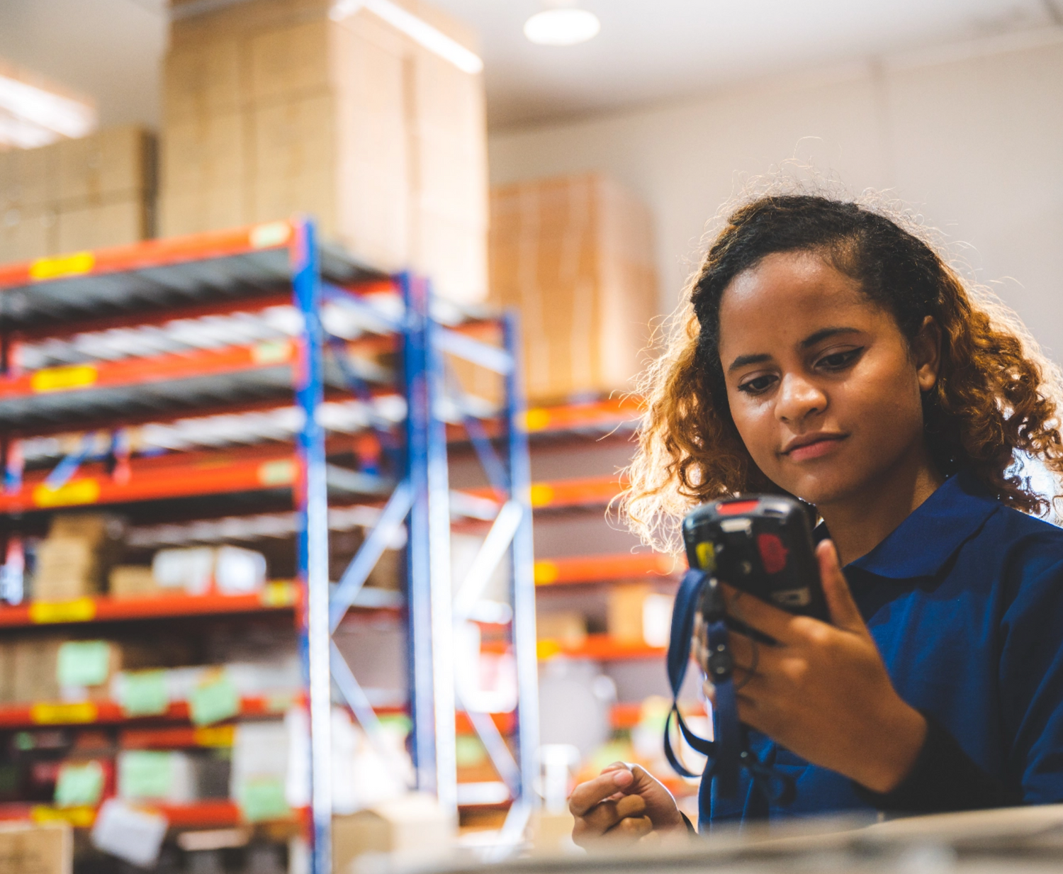 Woman at work looking at a handheld device